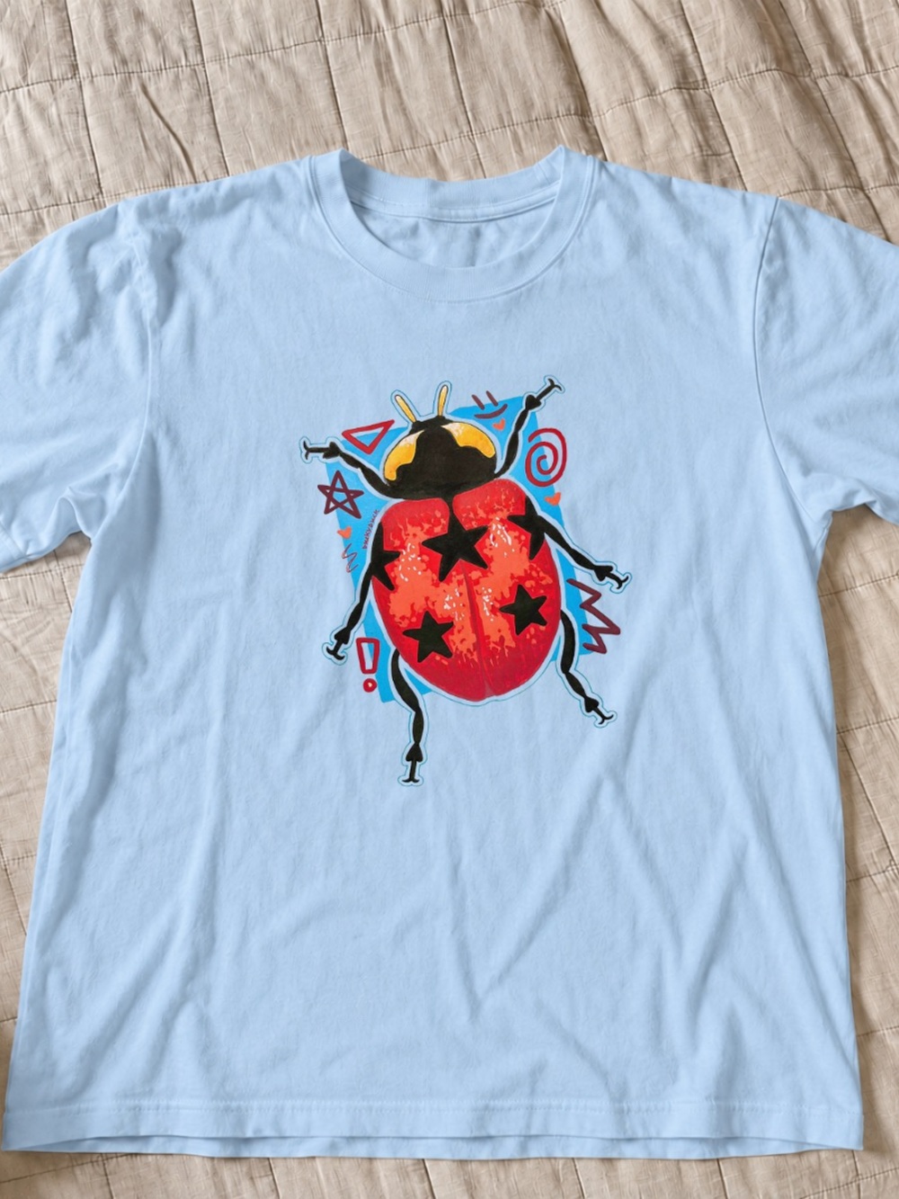 Light Blue Tee with Red Ladybug Graphic